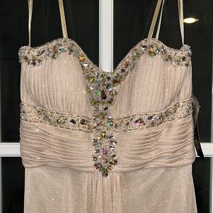 Champagne with gold shimmer strapless gown with jewel details